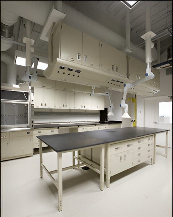 Modern laboratory with fume hoods and cabinets.
